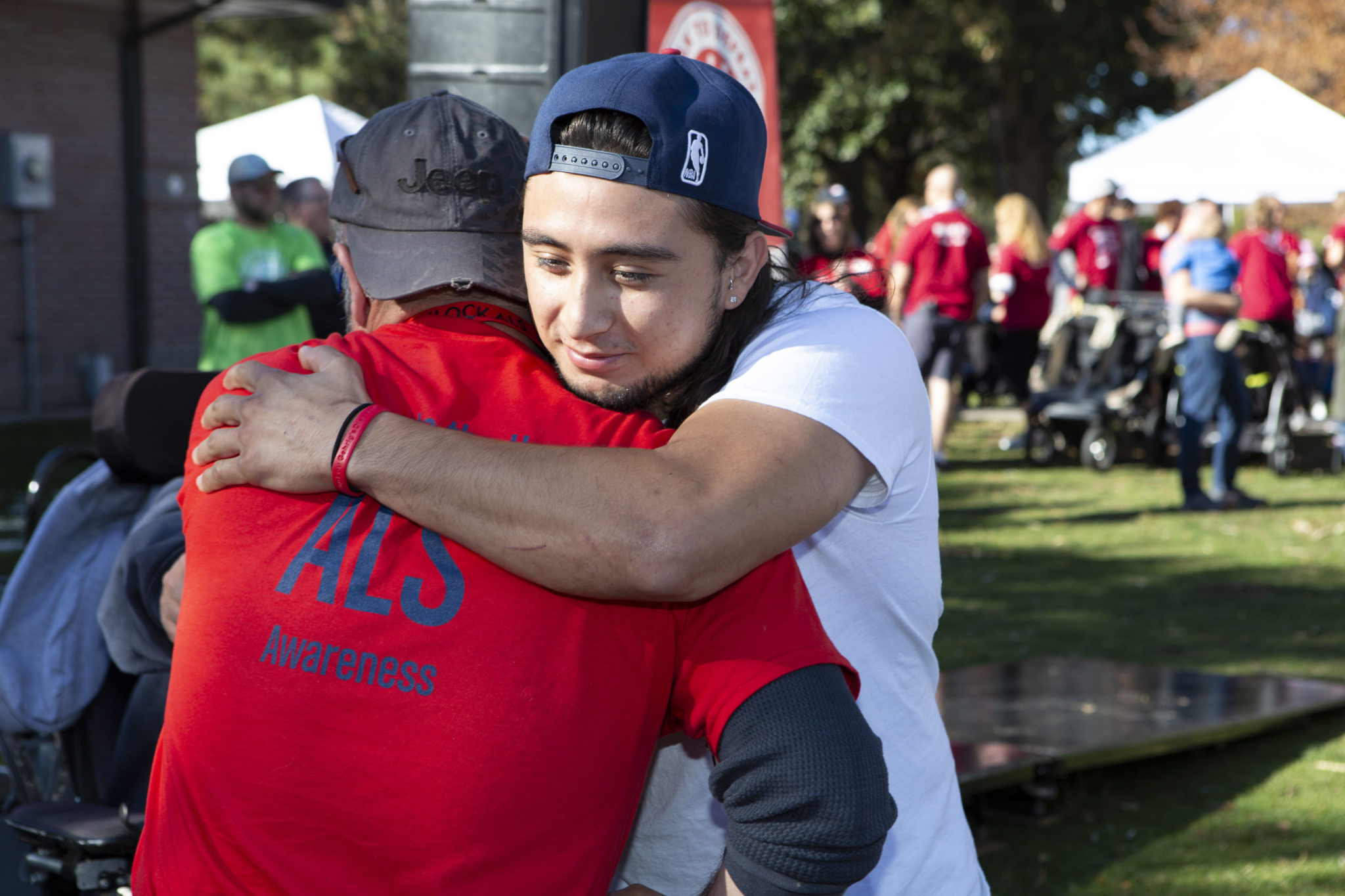 2019 ALS Denver Walk two unlock participants hugging.