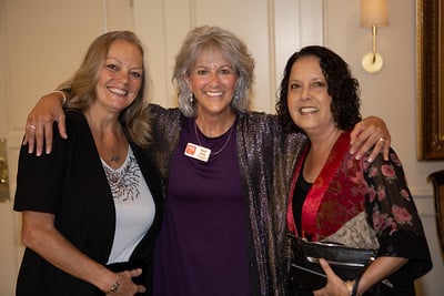 Care Coordinator Mary with two lovely ladies at the 2023 Sunset Gala