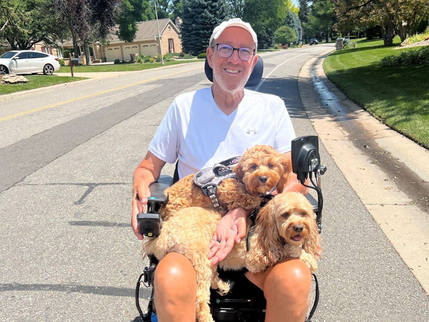 Joel Goldhirsh and his two cockapoos